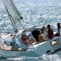 A Universal Sailing School yacht sailing on a sunny day