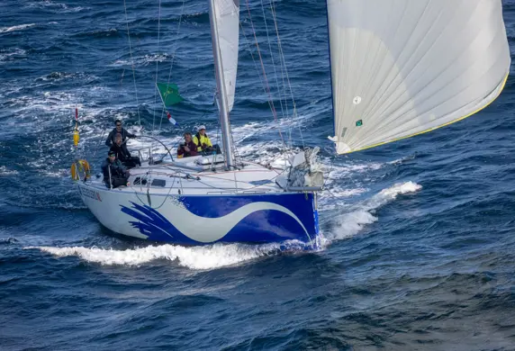 A yacht with its spinnaker up