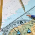 A close up of navigational equipment on a chart at North Oxford Marine Training, Grimsby Reservoir, Banbury