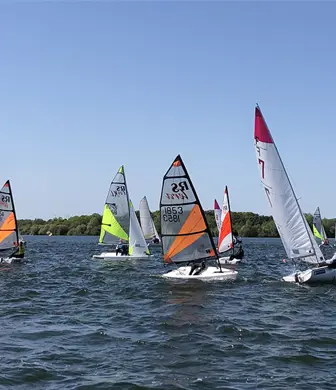 A group of RS Lasers racing on the reservoir at the Royal Hospital School Sailing Academy, Ipswich