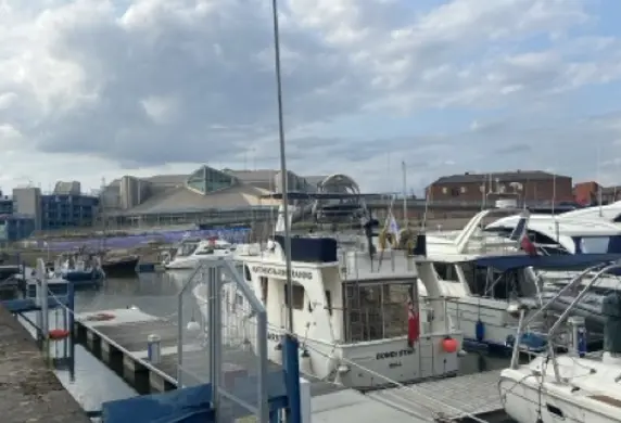 View from the Marina of cruiser boats in the mooring with a RYA Training Centre flag flying