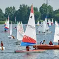 A variety of dinghies sailing on a lake 