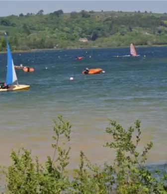A variety of dinghies and sail boats on Carsington Water at Carsington Sports and Leisure, Ashbourne, Derbyshire