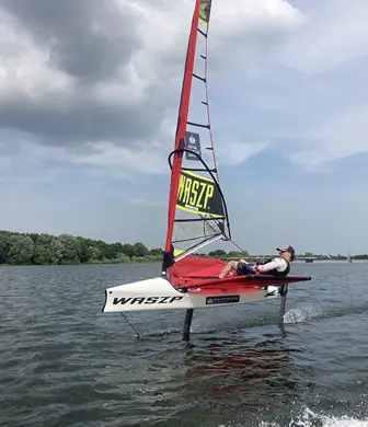 A Waszp sailing boat foiling on the reservoir at the Royal Hospital School Sailing Academy, Ipswich