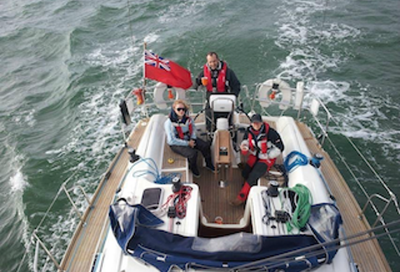 Universal Sailing School view of a yacht and its crew taken by someone up the mast