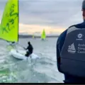 Dinghies sailing on the water at the Andrew Simpson Centre