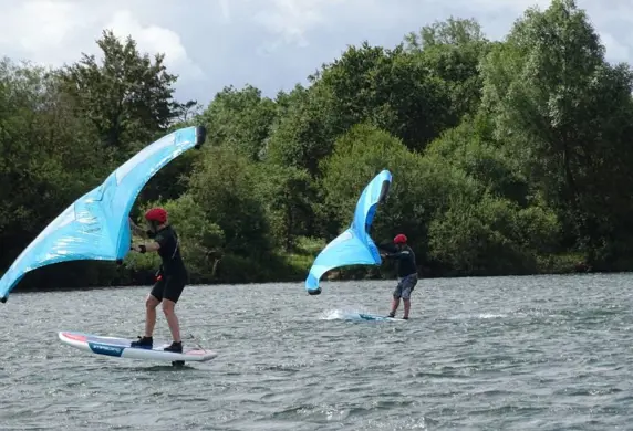 Two people foiling on the water