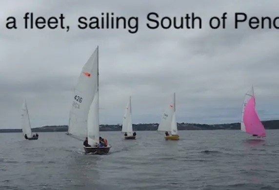 A group of yachts from Cody Sailing Club sailing as a fleet south of Pendennis Point, Cornwall