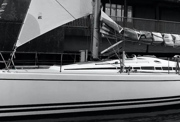 The hull of a yacht in black and white