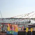 A club house building decorated with flags and banners for an event