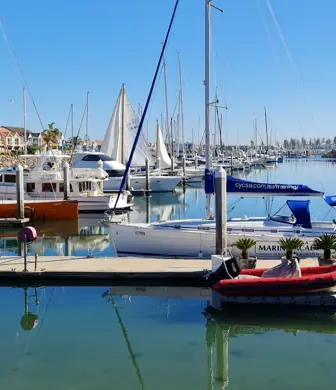 A sail training yacht from Cruising Yacht Club of South Australia moored in the habour at North Haven, South Australia