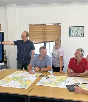 Group of people on map training course